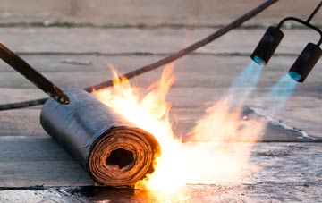 Tore asphalt flat roofing repairs